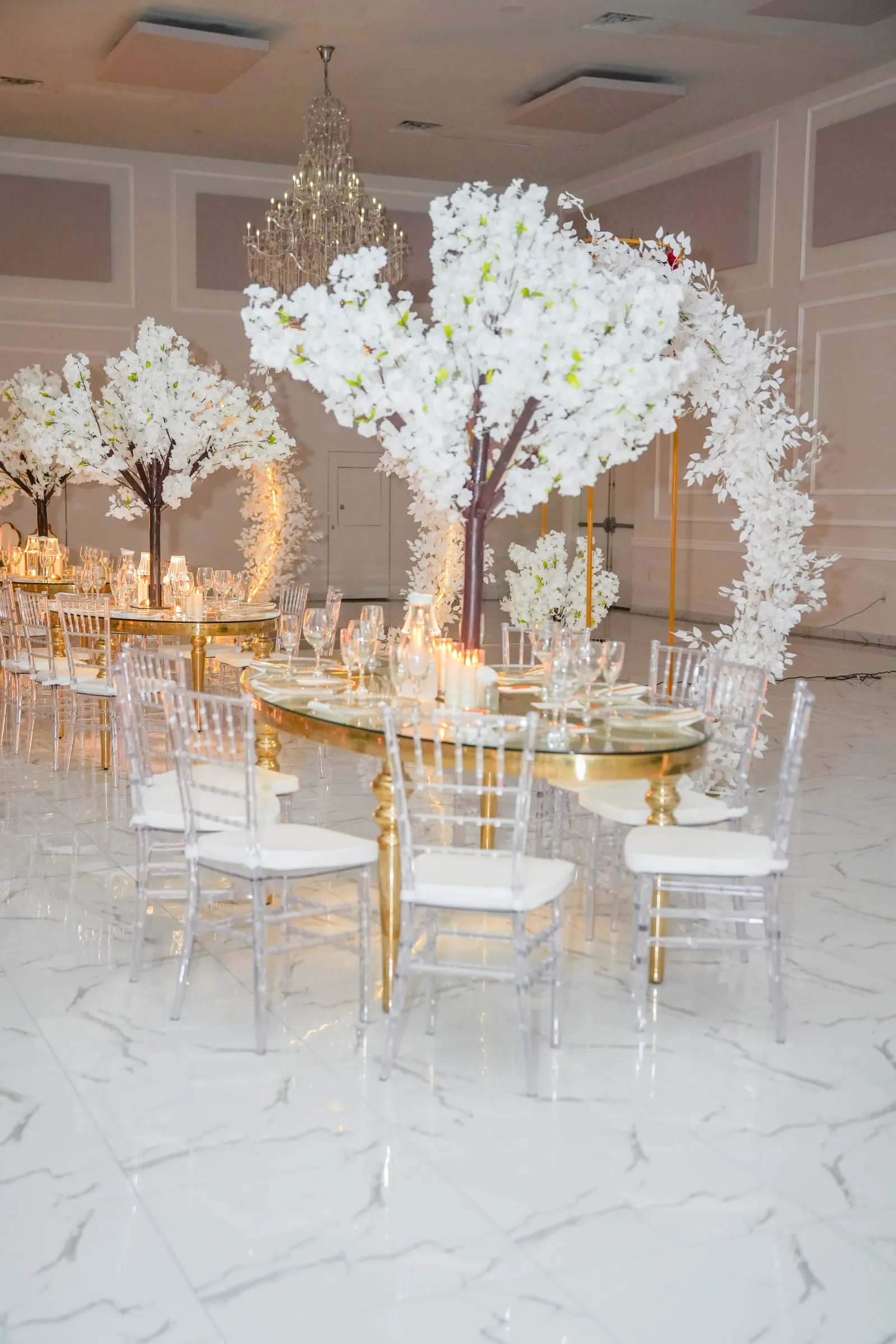 Cherry blossom centrepieces on gold tables