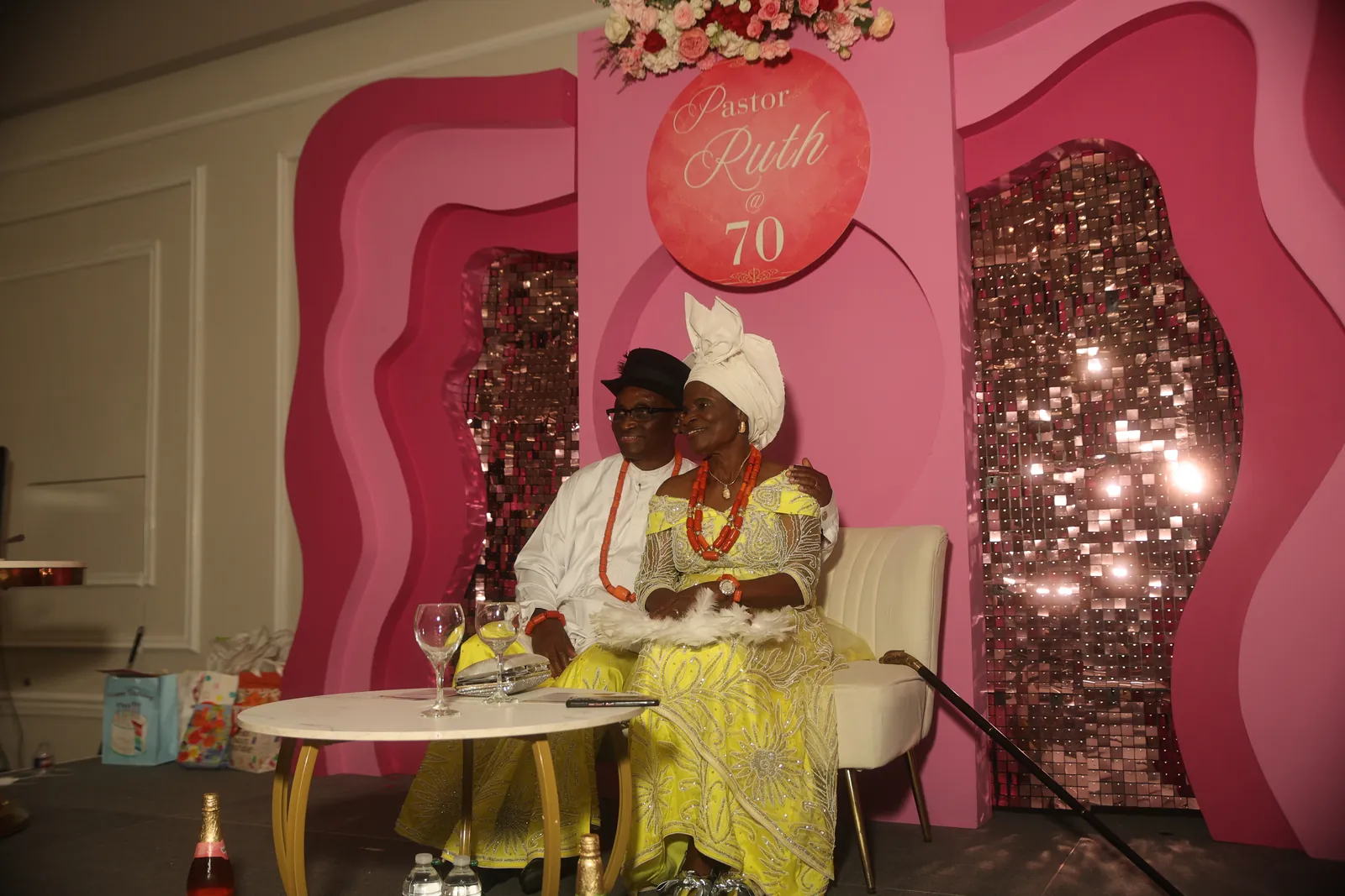 A 70th birthday celebration staged against a custom backdrop